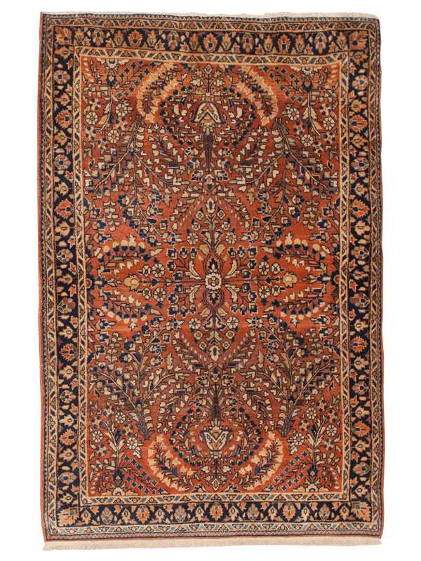 Tappeto saruq persiano antico con intricati dettagli decorativi floreali su sfondo arancione e sul bordo blu scuro